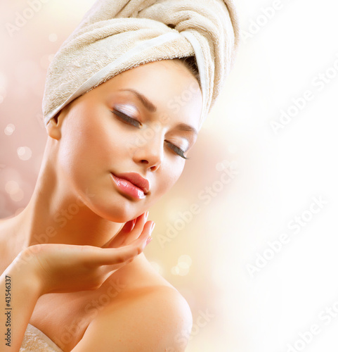 Photo: Spa Girl. Beautiful Young Woman After Bath Touching Her Face Spa Girl. Beautiful Young Woman After Bath Touching Her Face