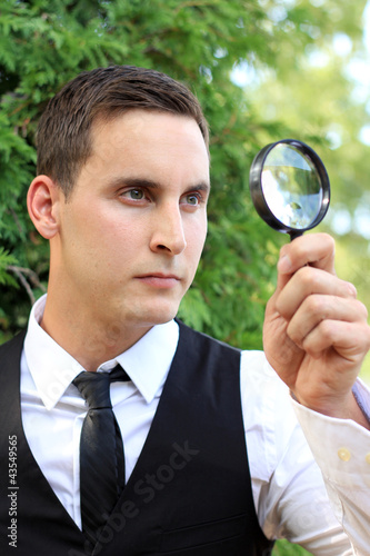 Photo: Man with Magnifying Glass Man with Magnifying Glass