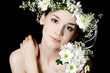 Portrait of the beautiful girl with flowers in hair