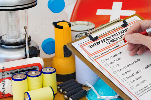 Photo: Hand completing Emergency Preparation List by Equipment Hand completing Emergency Preparation List by Equipment