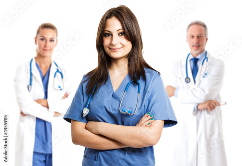 Foto: Nurse in front of her medical team Nurse in front of her medical team