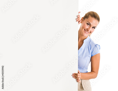 Photo: Woman showing a blank board Woman showing a blank board