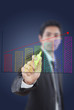 Photo: Businessman write finance graph for trade stock market. Businessman write finance graph for trade stock market.