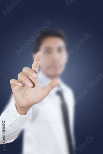 Photo: Businessman pushing on the whiteboard. Businessman pushing on the whiteboard.