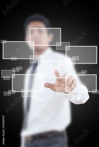 Photo: Businessman pushing Button on the whiteboard. Businessman pushing Button on the whiteboard.