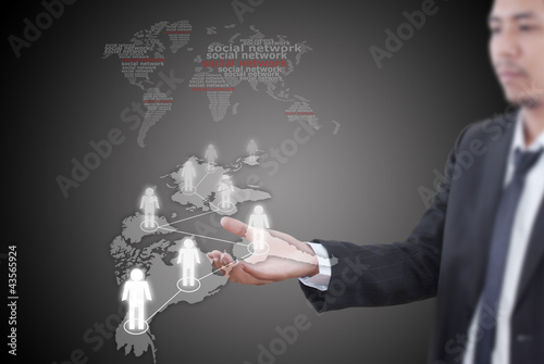 Photo: Businessman Holding Social Network diagram. Businessman Holding Social Network diagram.