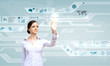 Foto: Businesswoman and touch screen technology Businesswoman and touch screen technology