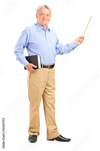 Photo: Male teacher holding a wand and book Male teacher holding a wand and book