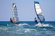 Two windsurfers in action