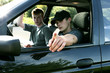 Two boys sitting in a car 