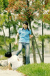 Photo: A woman kicking her brother A woman kicking her brother