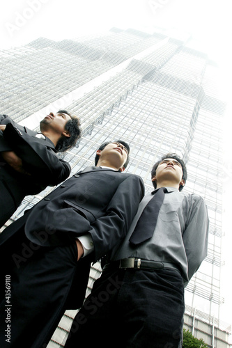 Photo: Three men in office attires Three men in office attires