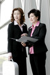 Two business women discussing a project 