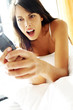 Woman playing games on her hand phone 