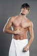 Muscular man wrapped in towel 