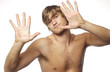 Shirtless man showing ten fingers 