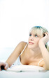 Photo: Woman daydreaming on the bed Woman daydreaming on the bed