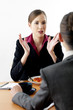 Businesswomen talking to each other over lunch