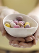 Mini eggs in bowl with model