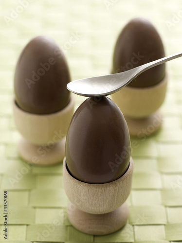 Photo: Chocolate eggs in egg cups Chocolate eggs in egg cups