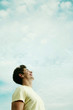 Young man laughing while looking up