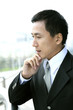 Businessman holding his chin