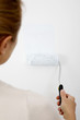 Foto: Woman painting wall Woman painting wall