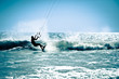 Kite surfing in waves.