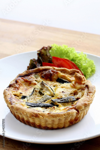 Photo: Quiche and vegetables on a plate Quiche and vegetables on a plate