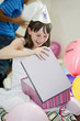 Girl opening her birthday present