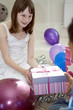 Girl receiving present from her friend