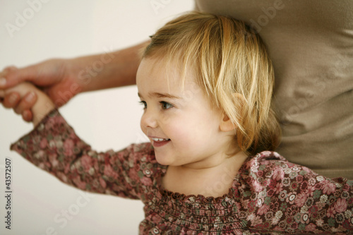 Photo: Girl playing with her mother Girl playing with her mother