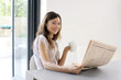 Woman reading newspaper