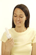 Woman looking at energy saving bulb