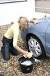 Woman washing her car