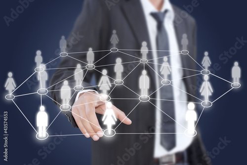 Photo: Businessman pushing people Social Network. Businessman pushing people Social Network.