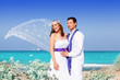 Photo: Couple in wedding day on beach sea Couple in wedding day on beach sea
