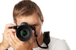 Photo: Closeup portrait of a young man taking a picture over white Closeup portrait of a young man taking a picture over white