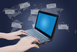 Hand pushing laptop keyboard with Social Network.