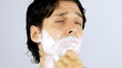 Young cool man shaving