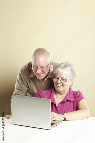 Photo: Senior using laptop Senior using laptop