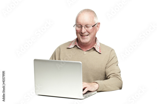 Photo: Senior using laptop Senior using laptop