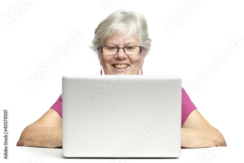 Photo: Senior using laptop Senior using laptop