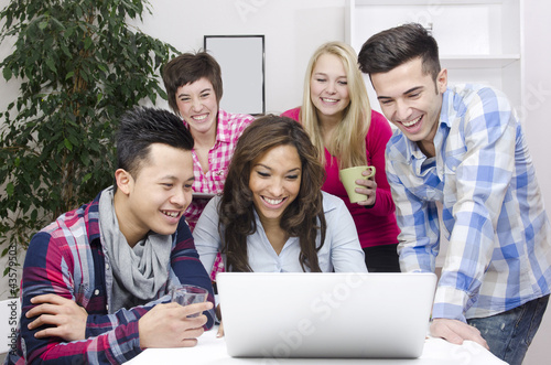 Photo: young diverse team of students or employees young diverse team of students or employees
