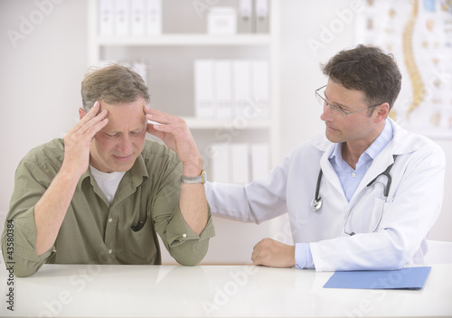 Photo: Doctor comforting patient Doctor comforting patient