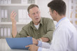 Photo: Doctor talking to patient Doctor talking to patient