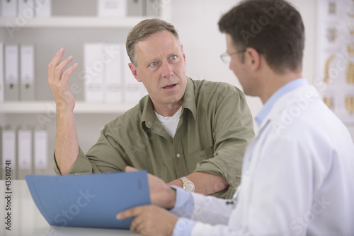 Photo: Doctor talking to patient Doctor talking to patient
