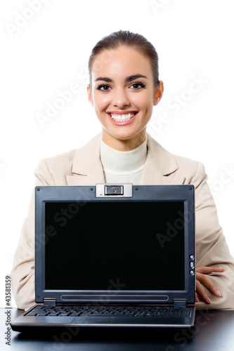Photo: Businesswoman showing laptop with copyspace Businesswoman showing laptop with copyspace