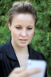 Young Attractive Businesswoman Texting On the Phone