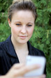 Young Attractive Businesswoman Texting On the Phone